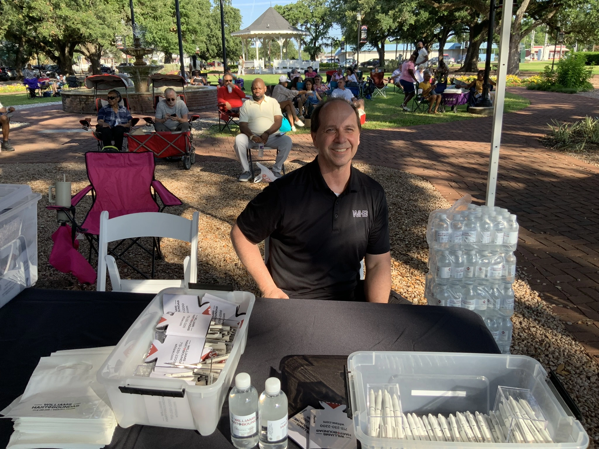 Williams Hart & Boundas booth at League Park with crowd gathered for Saturday Jazz Night